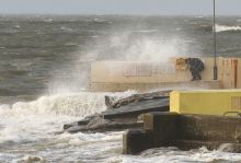 A man hiding from wind and rain during a storm in Galway